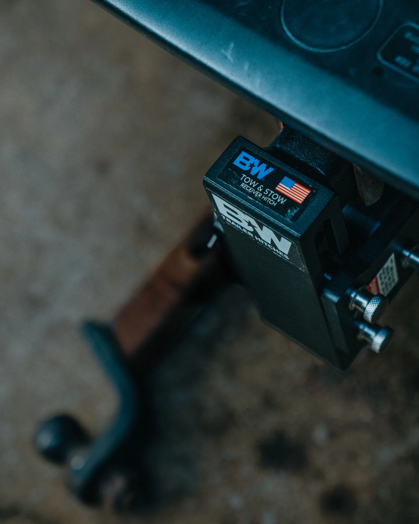 B&W trailer hitch product mounted behind a vehicle