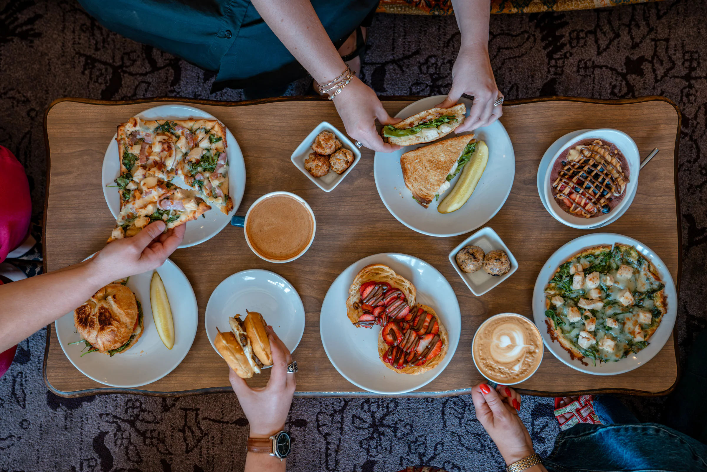 Hospitality and food photography of a full cafe table